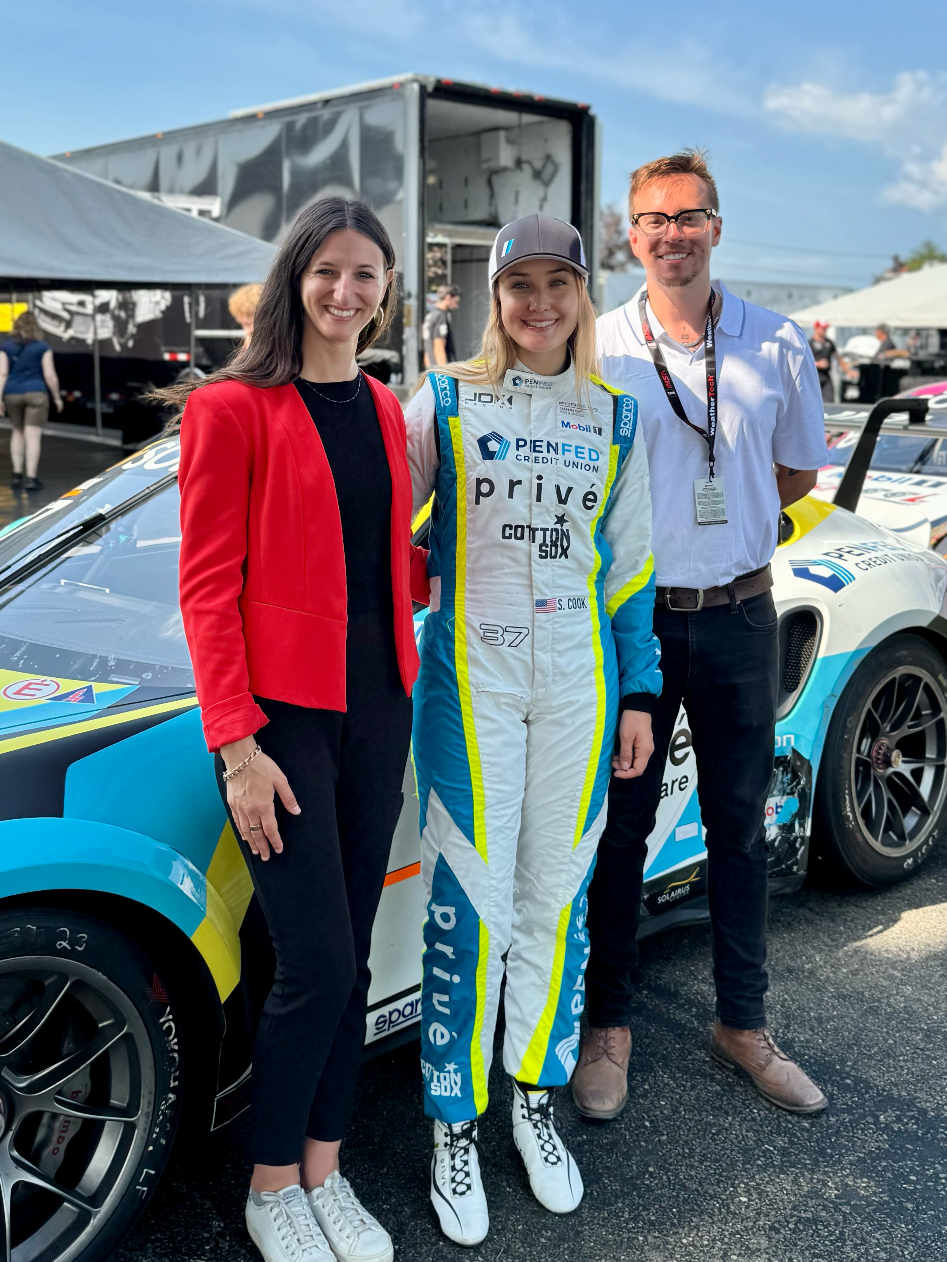 Snaptron's Team, Nicole and Arden, stand with Sabre Cook at Watkins Glen