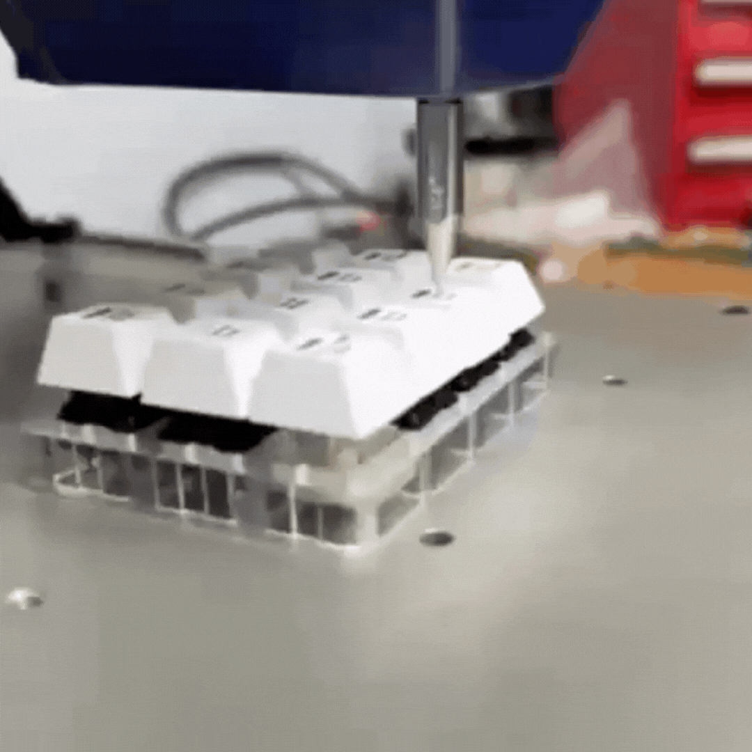 A repeating gif of Snaptron's Sapphire Switch Tester pressing a tactile key on a small keyboard to measure its force curve. 